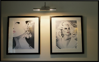 Jax Fashion Illustrations displayed on a wall